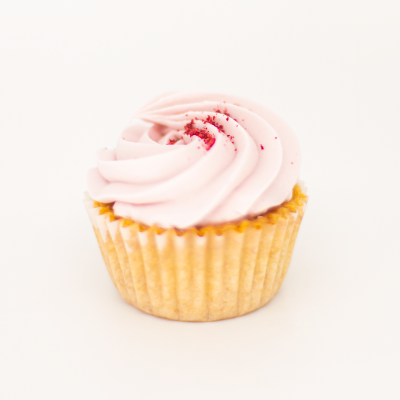 Indulge in a delightful raspberry cupcake, with its sweet and tangy flavor and a dollop of creamy frosting. Pair it perfectly with a crisp and refreshing Brut Cava, with its bright fruit notes that complement the cupcake&
