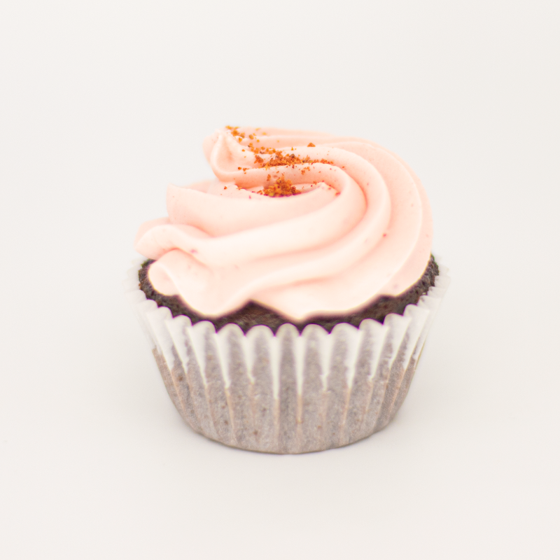 Savor the sweet taste of summer with a scrumptious strawberry cupcake, topped with creamy frosting and a juicy strawberry. Pair it perfectly with a crisp and refreshing Brut Cava, with its bright fruit notes that complement the cupcake&