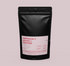 Bolsa de café color negro con sticker rosa personalizado